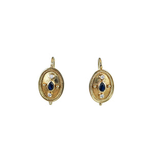 These 18ct yellow gold, Etruscan revival style earrings are set with diamonds and a centre sapphire |