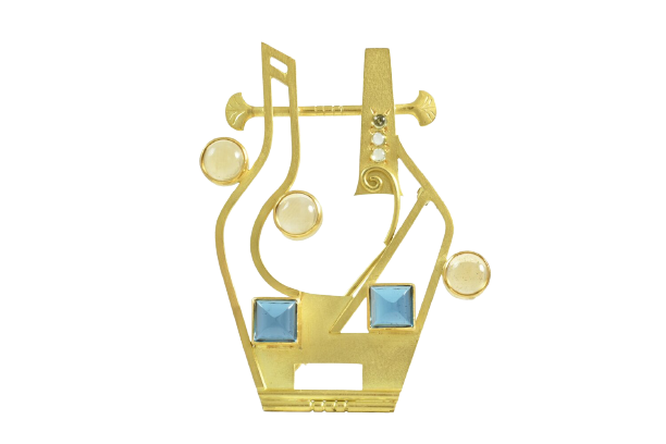 18ct. Yellow gold, blue topaz, citrine and peridot brooch by Dorothy Erickson.