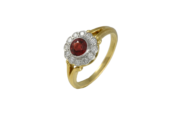 A contemporary 18ct Yellow and white gold, ruby and diamond set ring