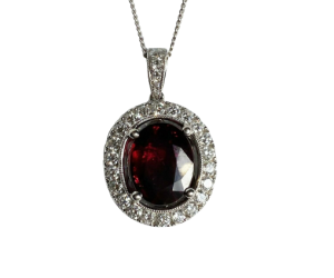 18ct white gold pendant set with a 5.03ct oval brilliant step cut ruby & diamonds.