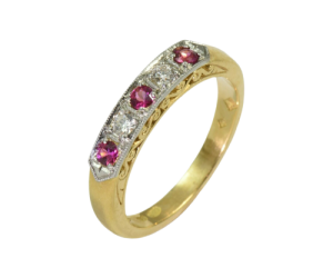 Contemporary 18ct. Yellow and white gold, pink sapphire and diamond ring.