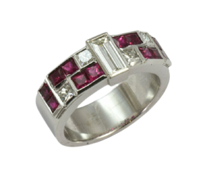 Contemporary 18ct. White gold, ruby and diamond ring.