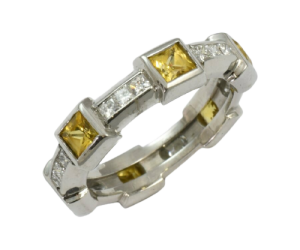 Contempoary 18ct White, Yellow sapphire and diamond ring.